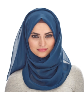 This image shows a woman wearing a hijab, a scarf wrapped to conceal the head, hair, and neck. Hijab is accompanied by loose, modest clothing. The majority of Muslim women who cover wear the hijab. Image courtesy of Google and Inayah Collection. 