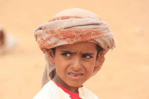 An adorable Bedouin boy who helped tend the camels. (photo courtesy of Sarah Hale and AMIDEAST)